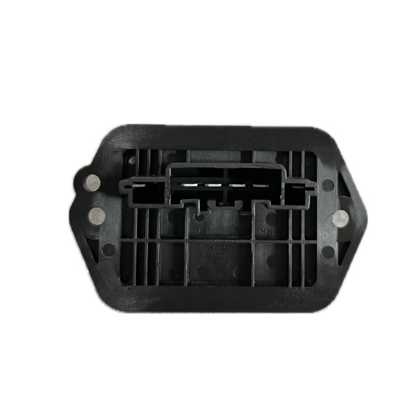 a black Mazda Cx-7 Fan resistor with holes